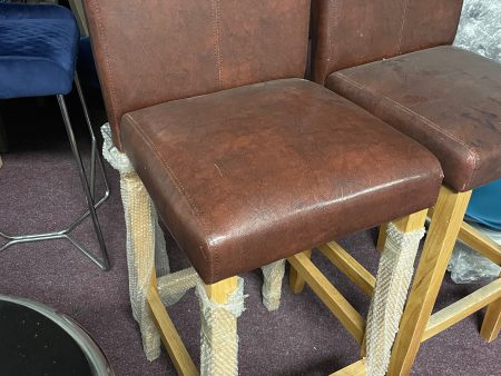 2 leather and oak colour bar stools Ex display  unwrapped so for collection only. Pay Instore after viewing Fashion