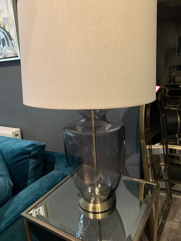 Tishan Florence Lamp. smokey grey glass  base with Natural linen shade available in outlet store For Sale